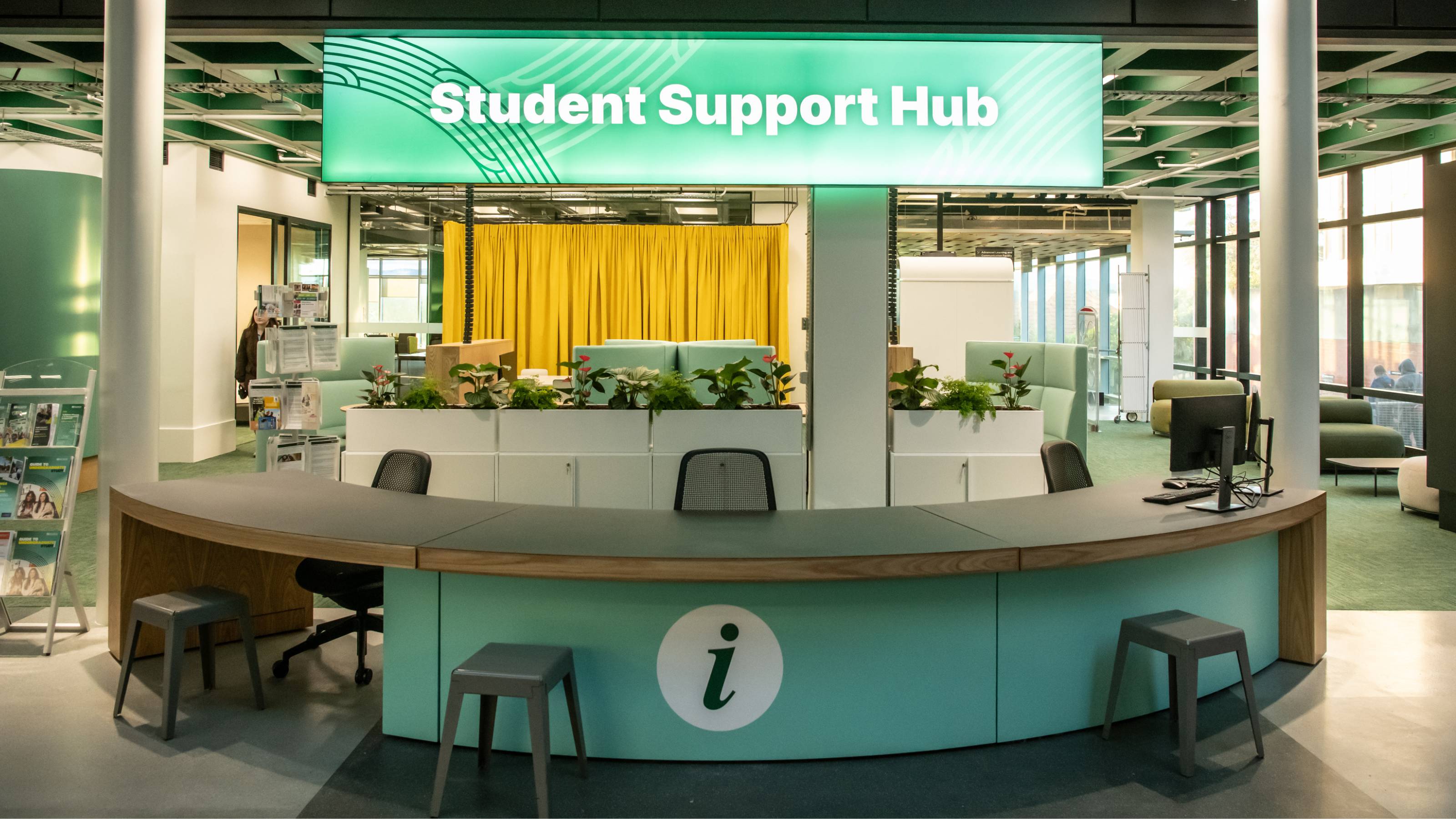 Student Support Hub reception area with information desk and seating.