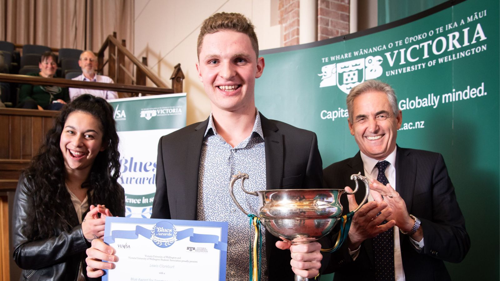 VUWSA president with Lewis clareburt with cup, and VC Grant guilford 