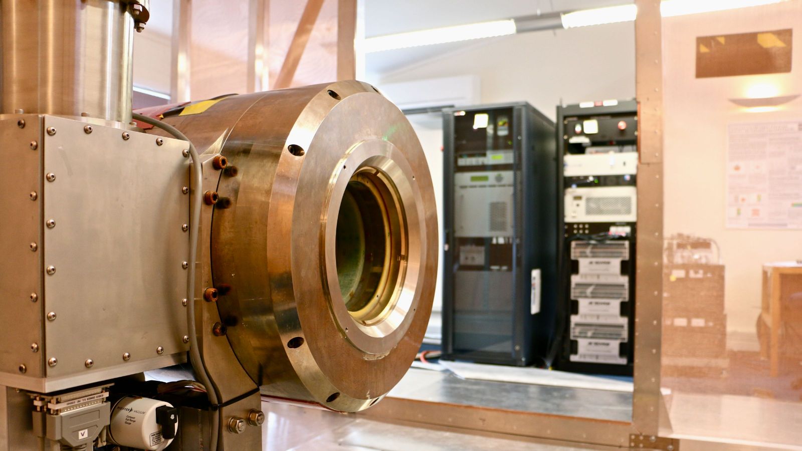 The copper-coloured metal inside of an MRI machine, in a Lab.
