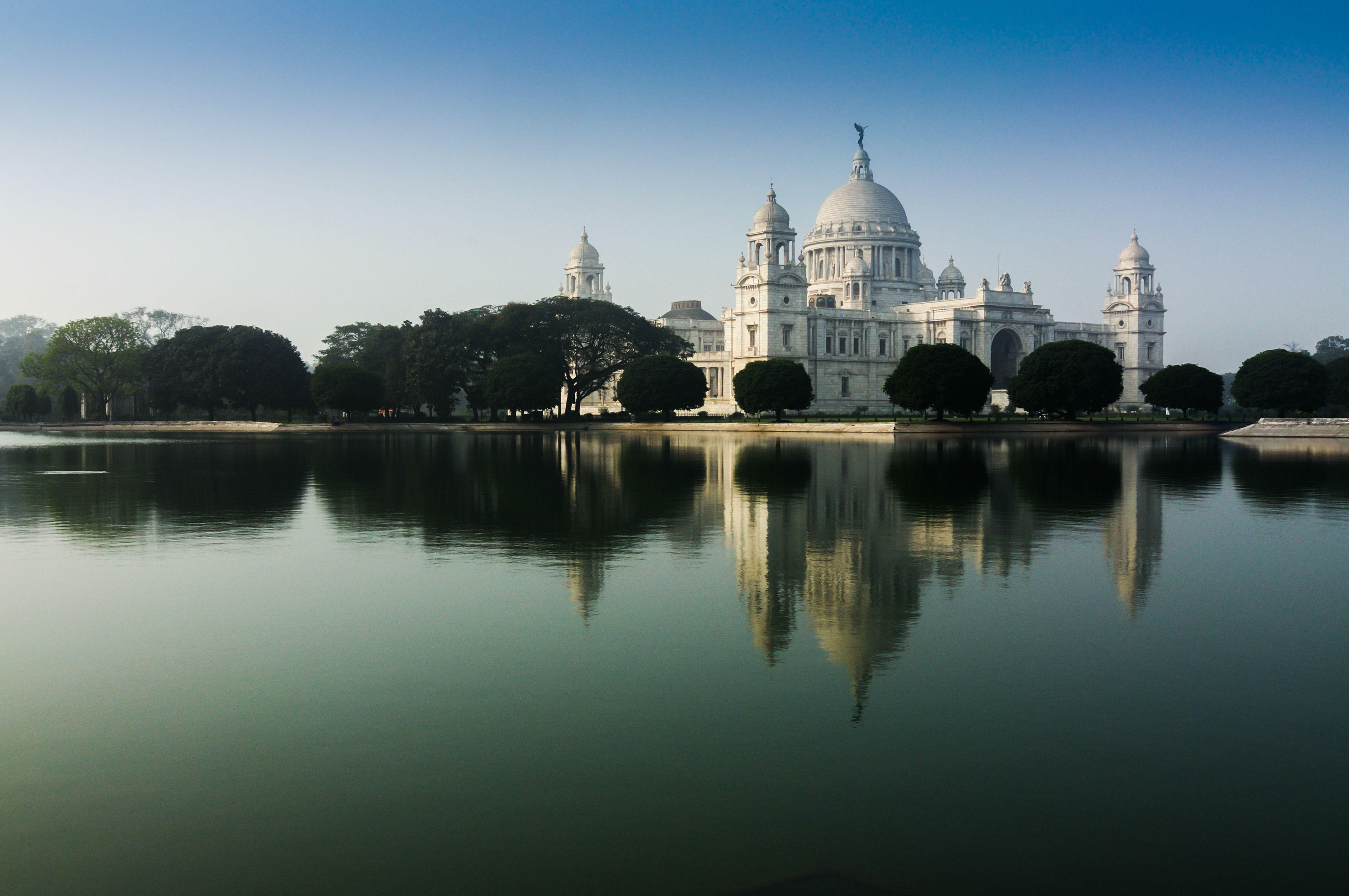 Looking at the Taj Mahal across a body of water.