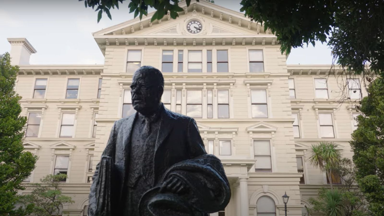 Image of the statue in front the campus building. 