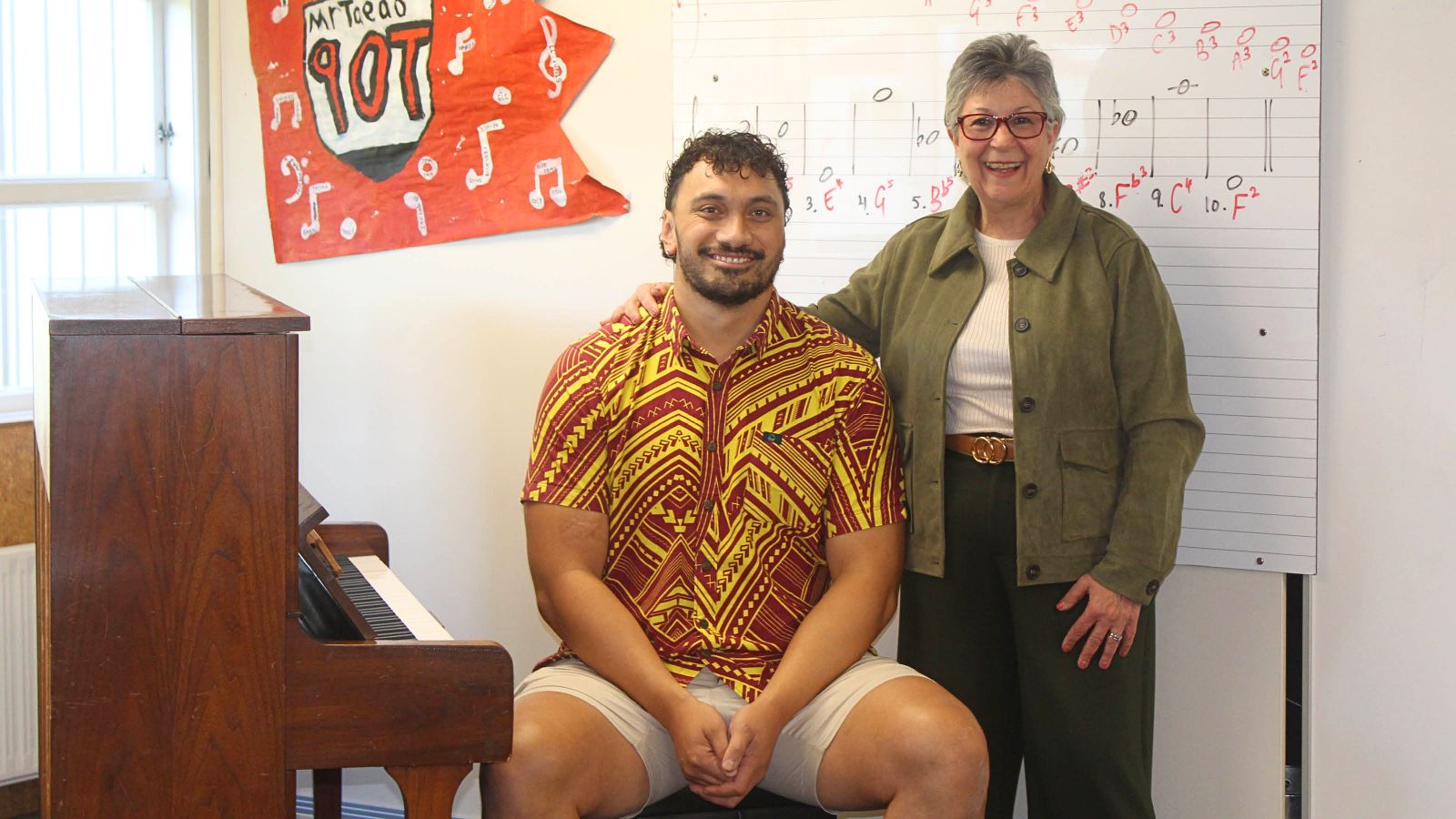Ofisa Taeao and Marina Kaichis in a music classroom next to a piano
