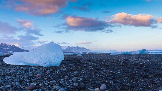 ice melting on stony beach