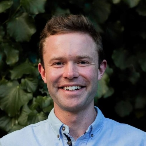 James McLean A smiling man in a blue shirt.