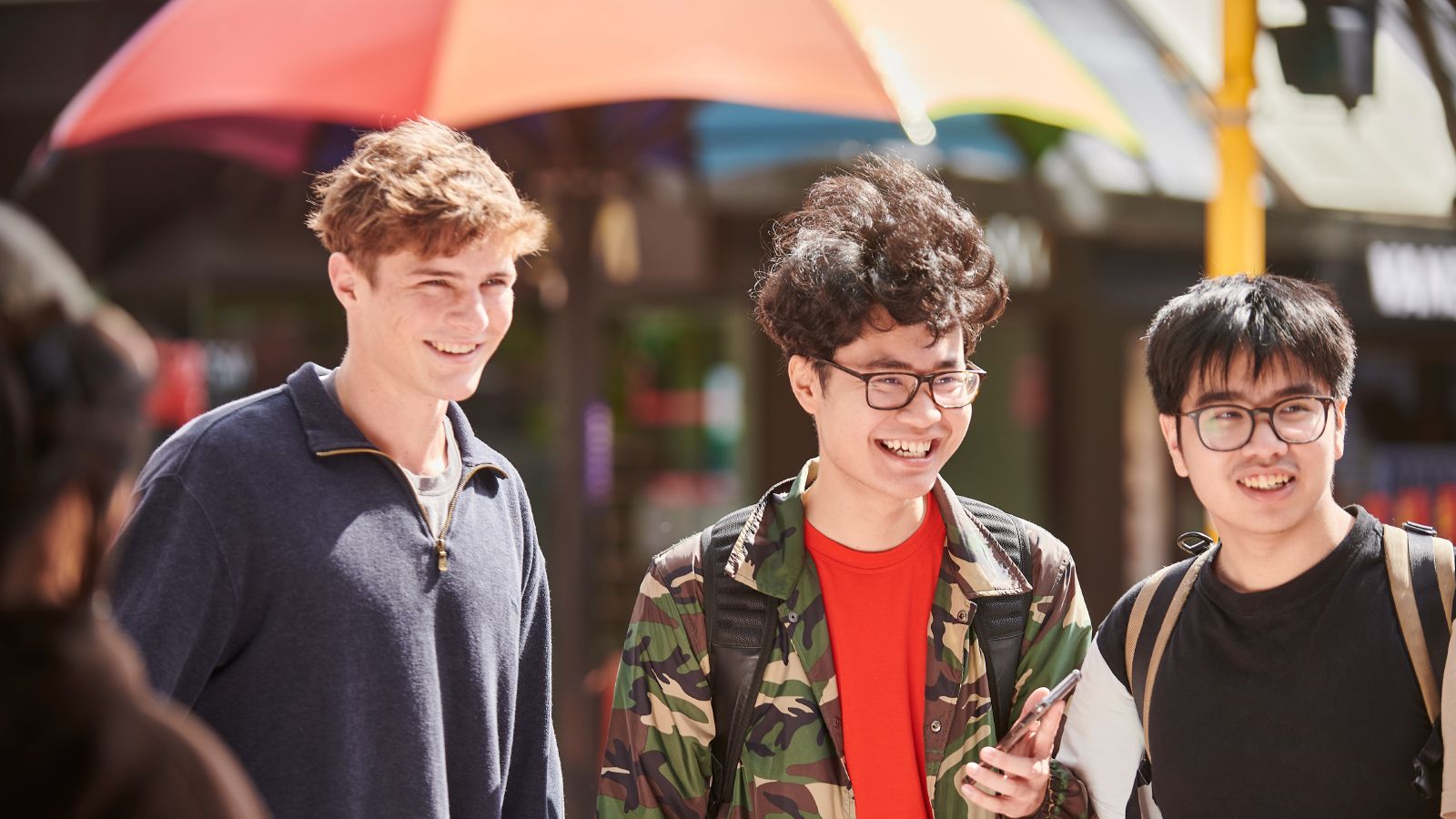 three students exploring cuba street