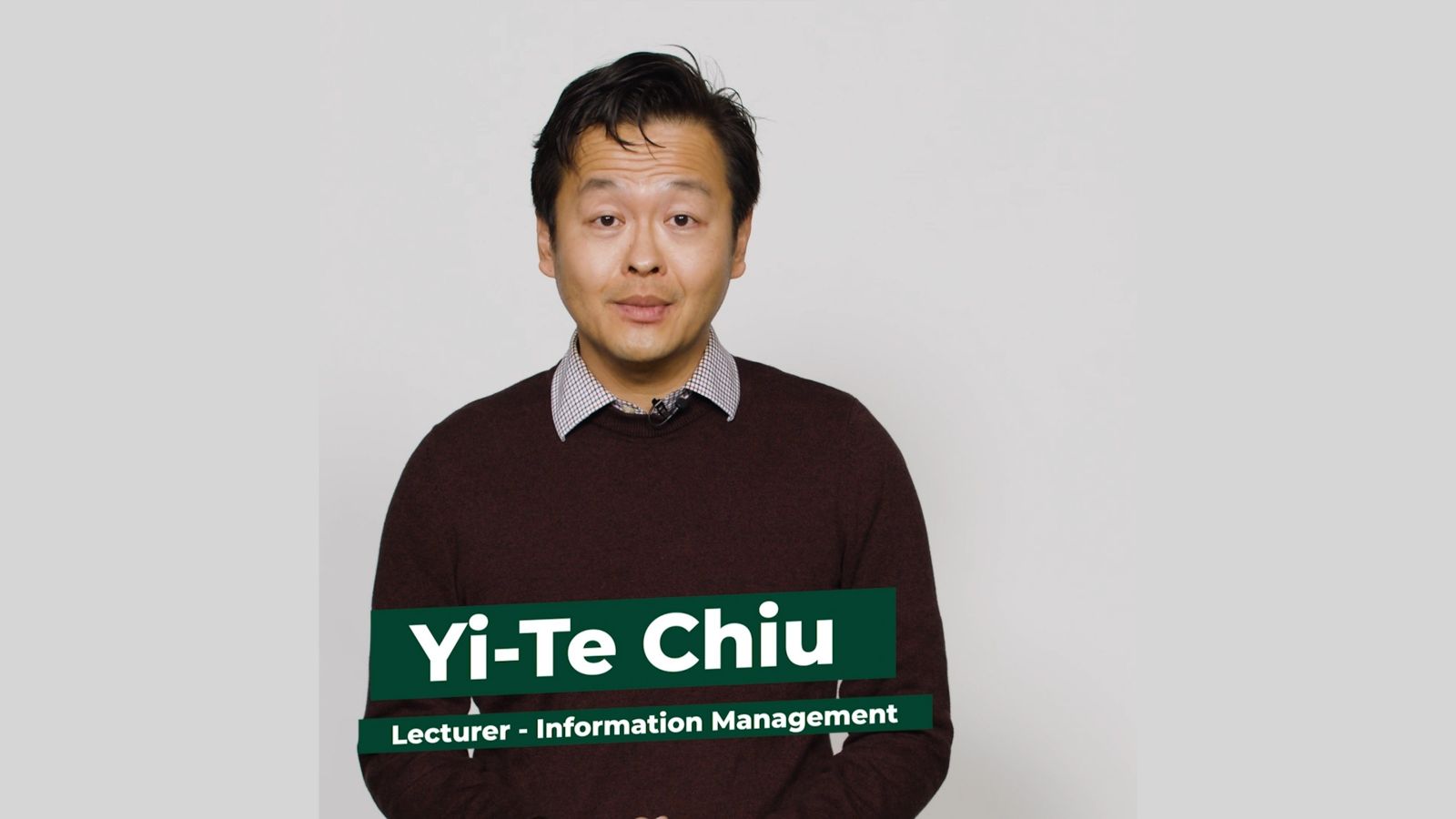 Information management lecturer Yi-Te Chiu stands facing the camera against a white backdrop.