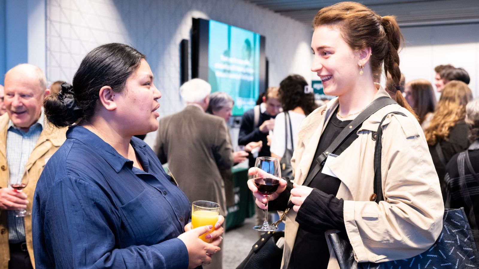 Scholarship recipient Evo Malifa meets lawyer Annah Casey-Solly at a reception