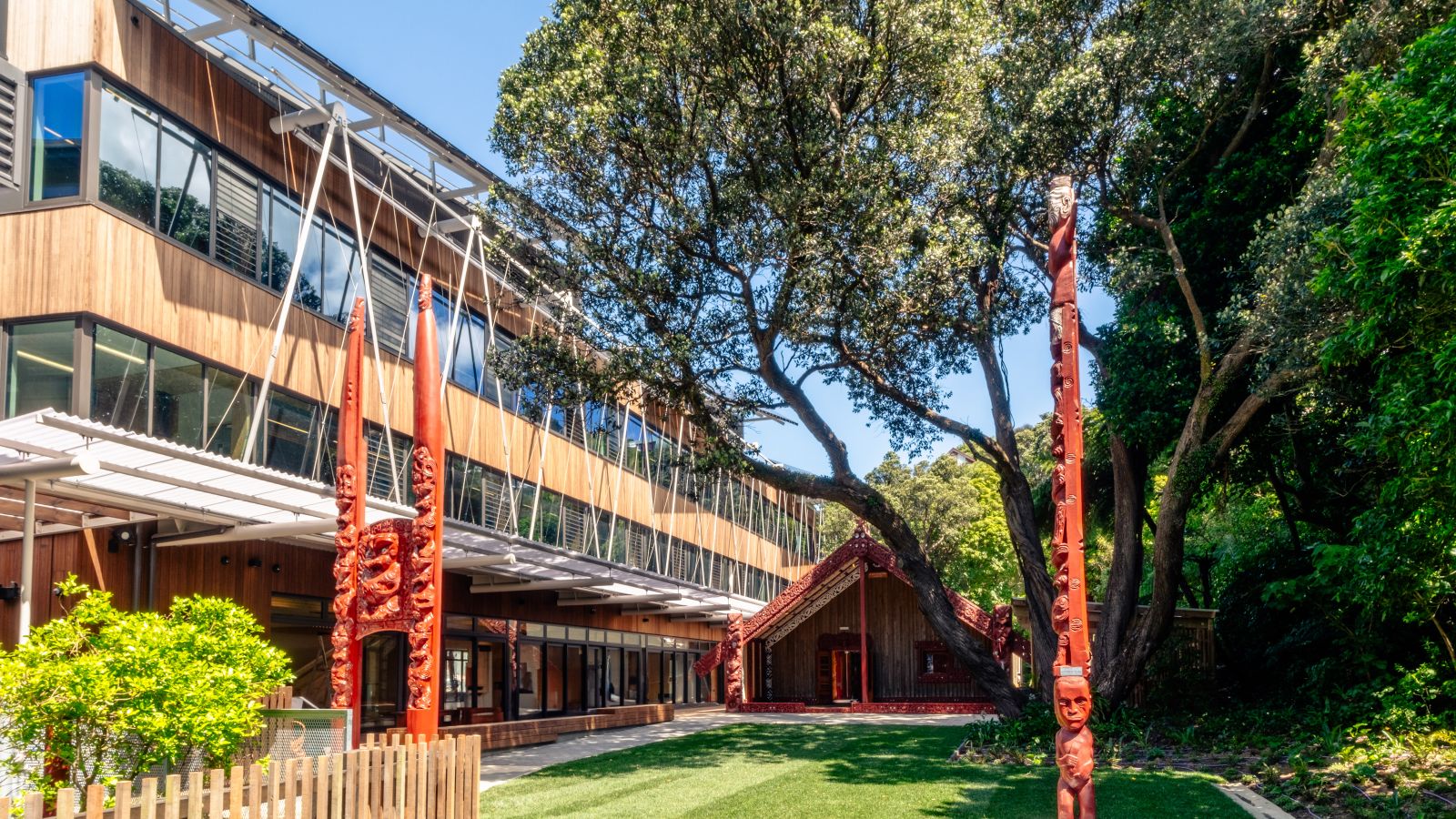 Te Herenga Waka marae showing Ngā Mokopuna and the wharenui from the lawn