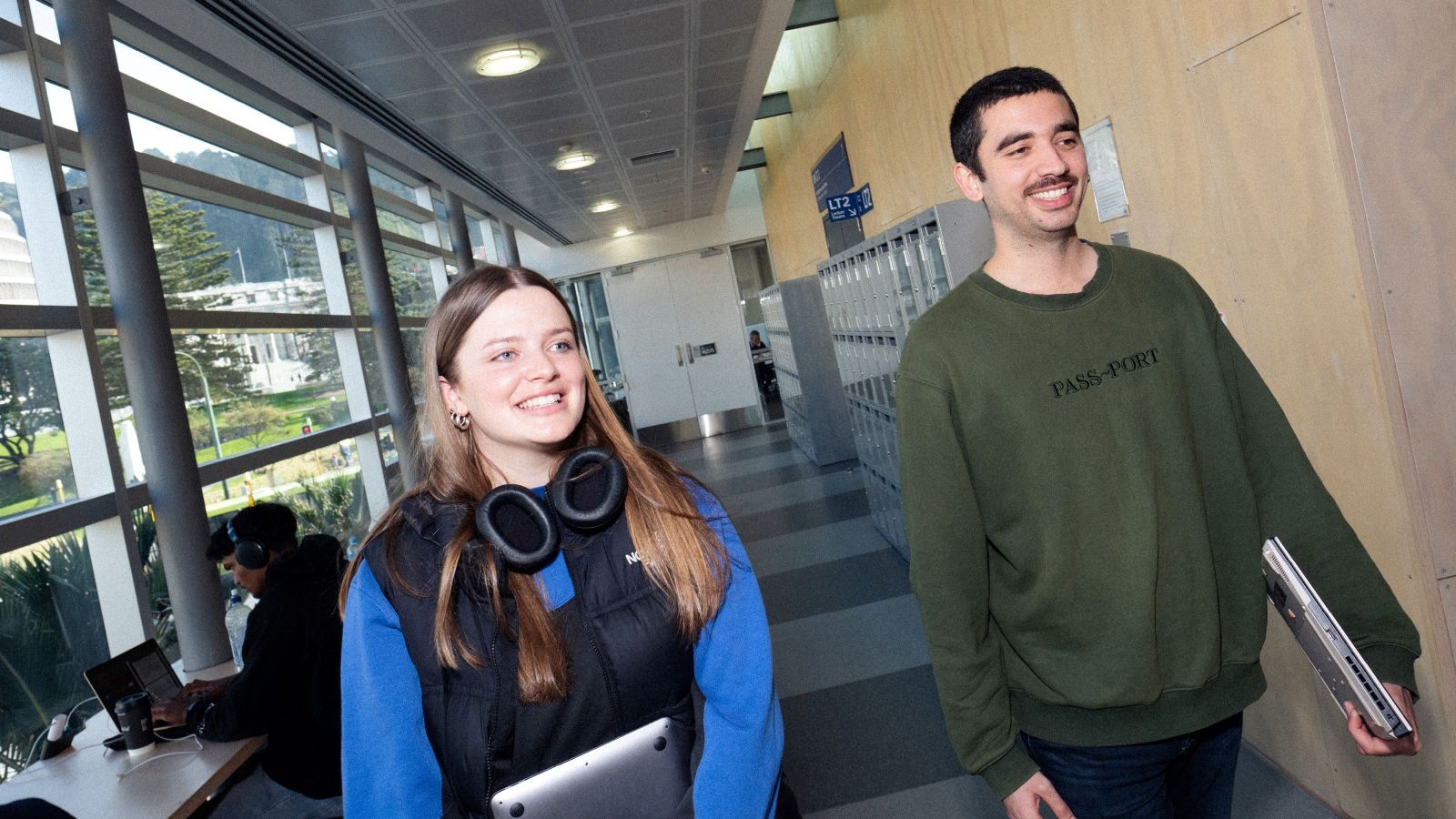 A male and female student walk along the corridor at Rutherford House