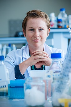 PhD student Lisa Johnston sitting in laboratory