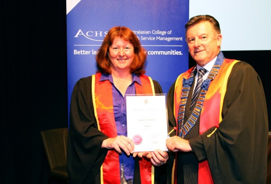 Prof Cumming receiving her Fellowship award from ACHSM