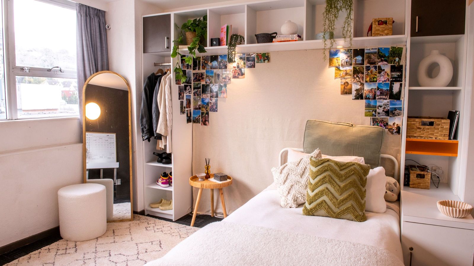 Single studio at Cumberland House, with a bed, shelves, and window visible.