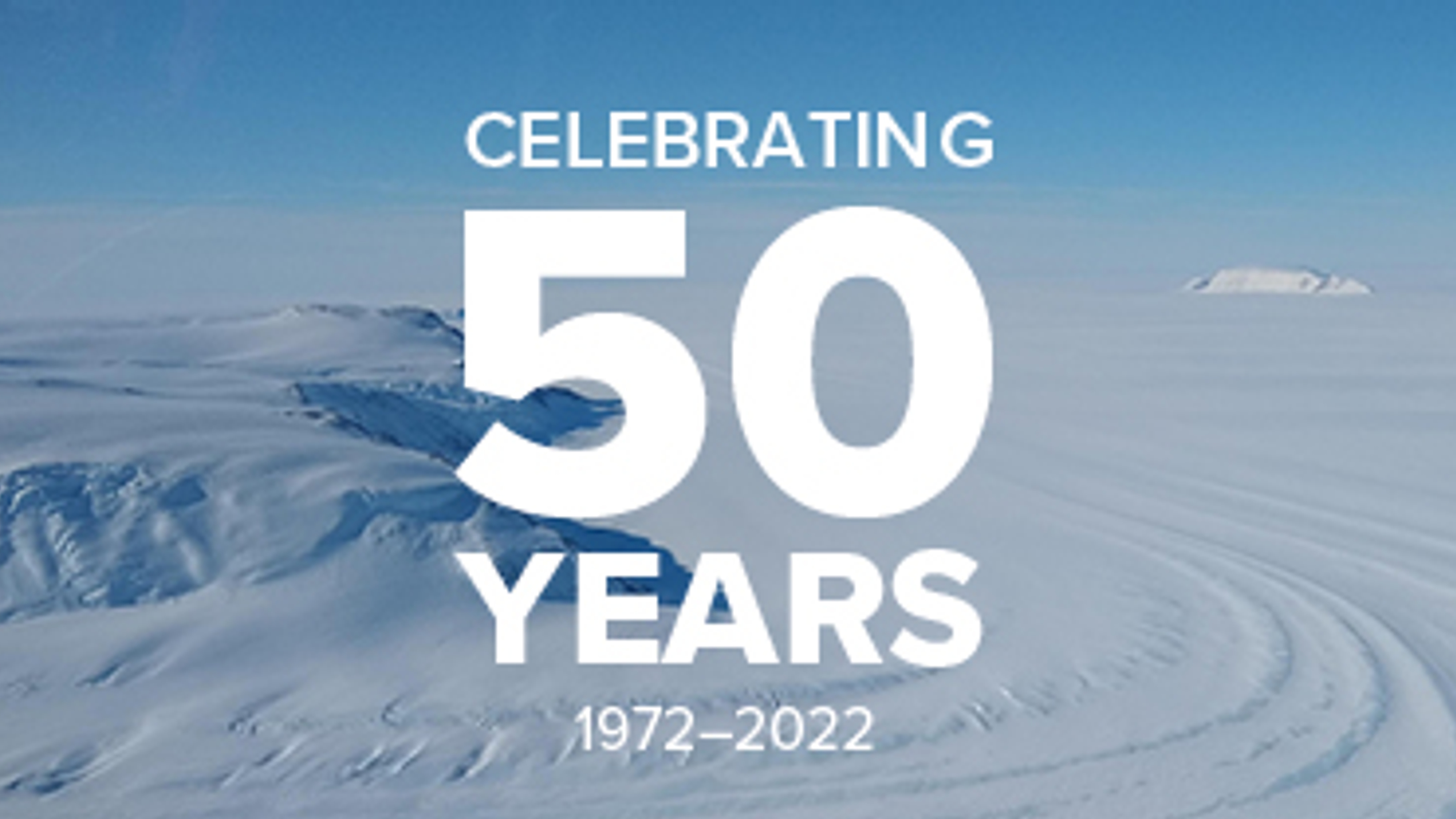 Snow covered Antarctic landscape with text overlay that says 'Celebrating 50 years, 1972-2022'