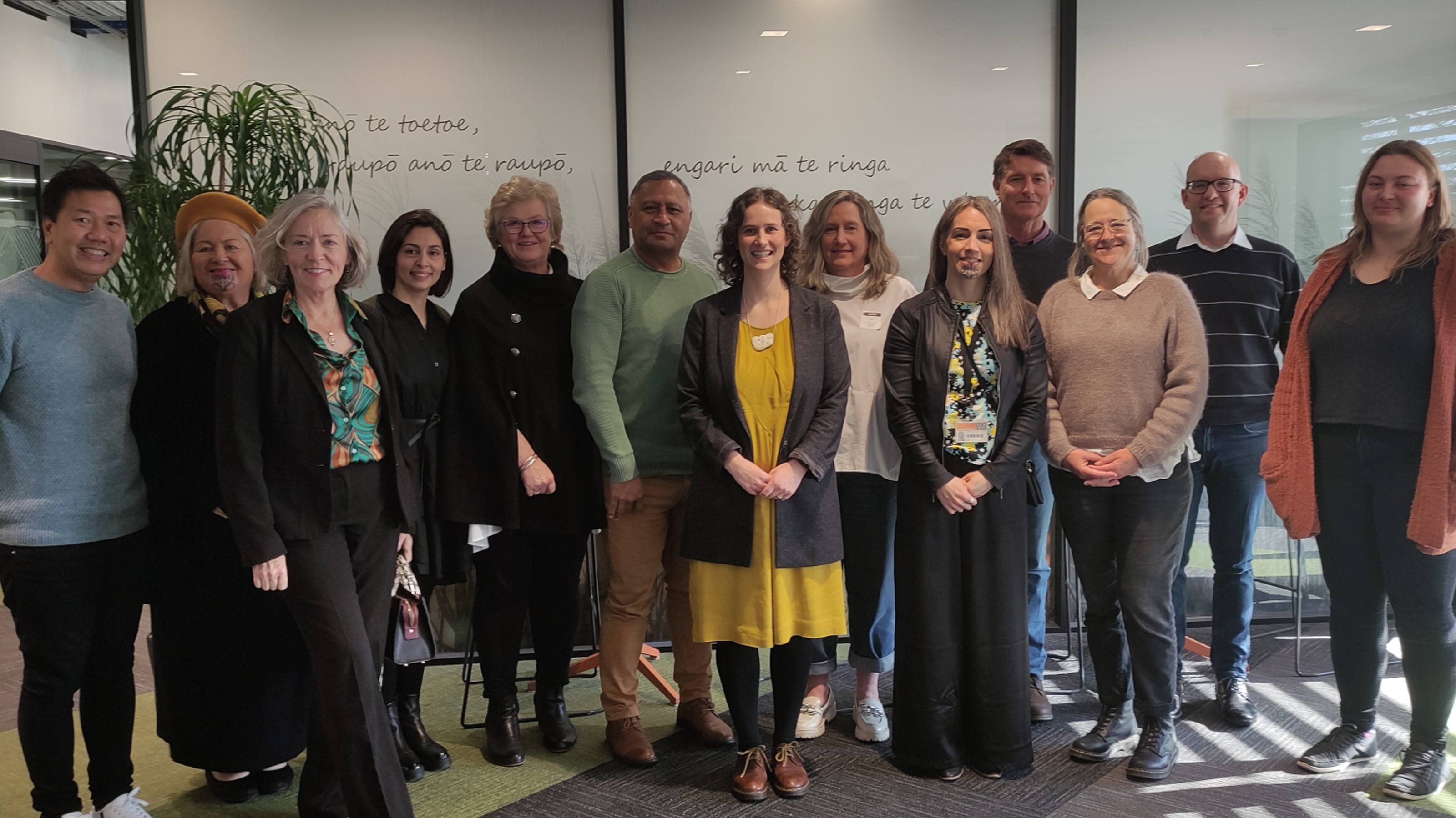 The research team who are exploring the early experiences of the assisted dying service in Aotearoa posing for a photo together.