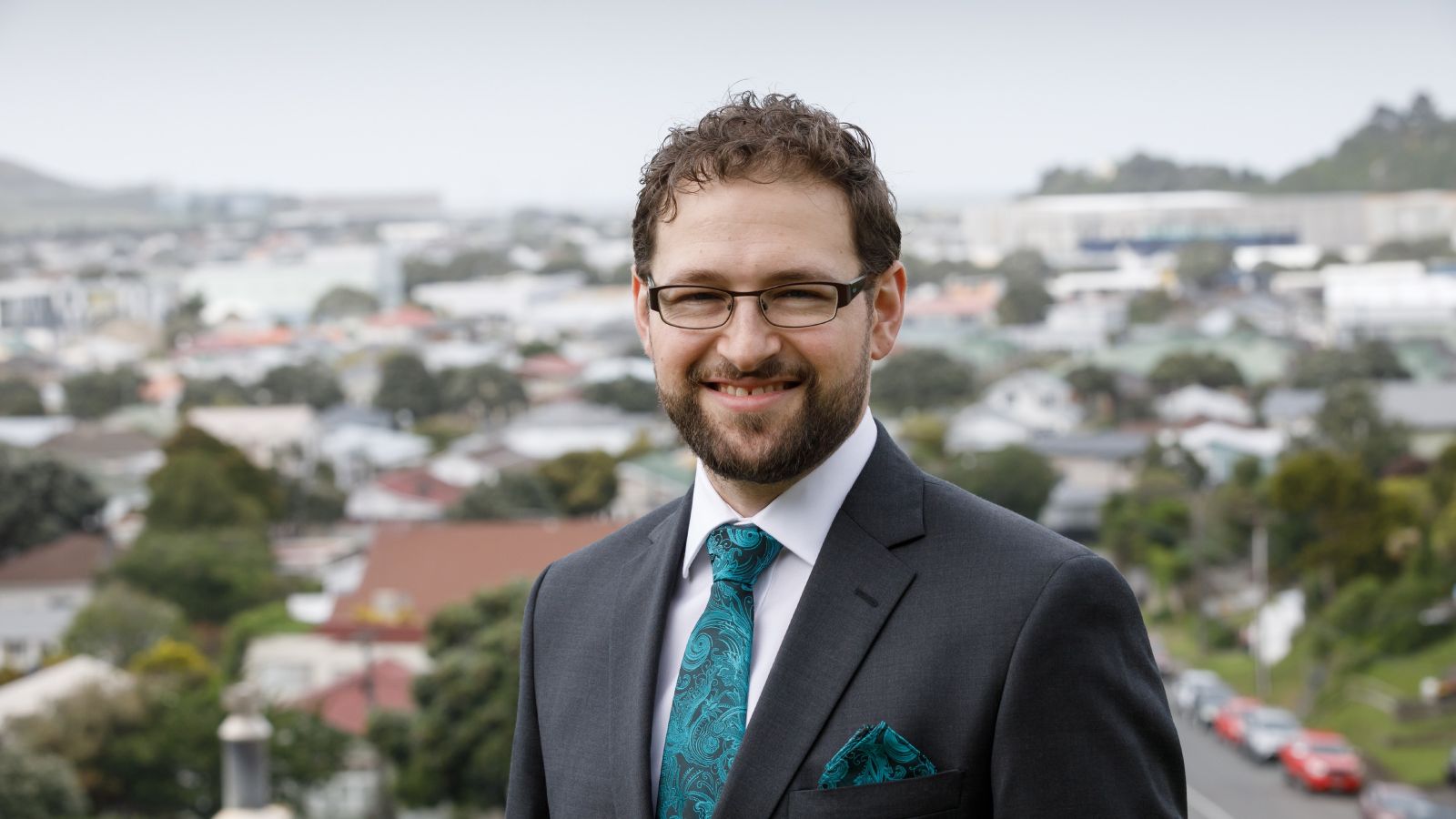 Head and shoulders photo of Griffen Ritchie in front of Wellington neighbourhood