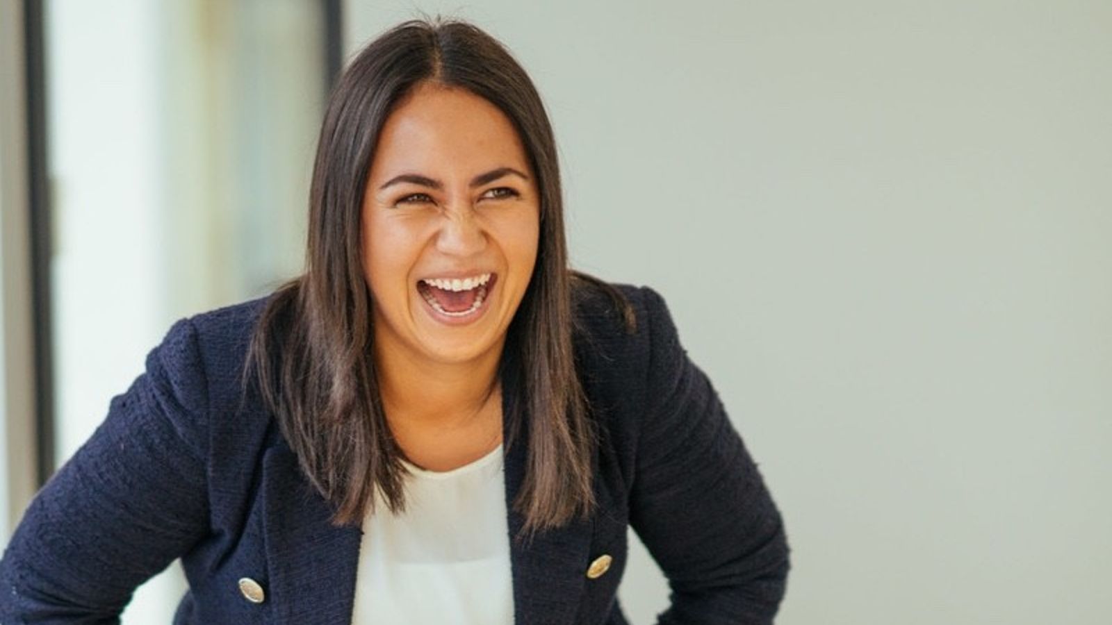 Head and shoulders photo of Rachel Nowicki laughing