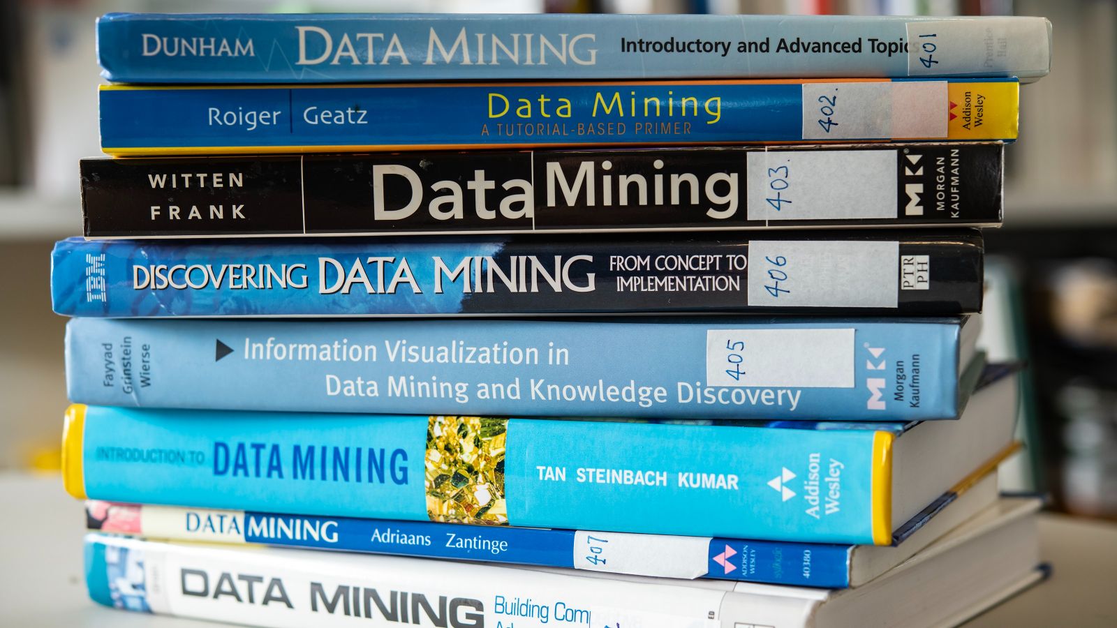 Stack of books whose spines all have titles referring to data mining