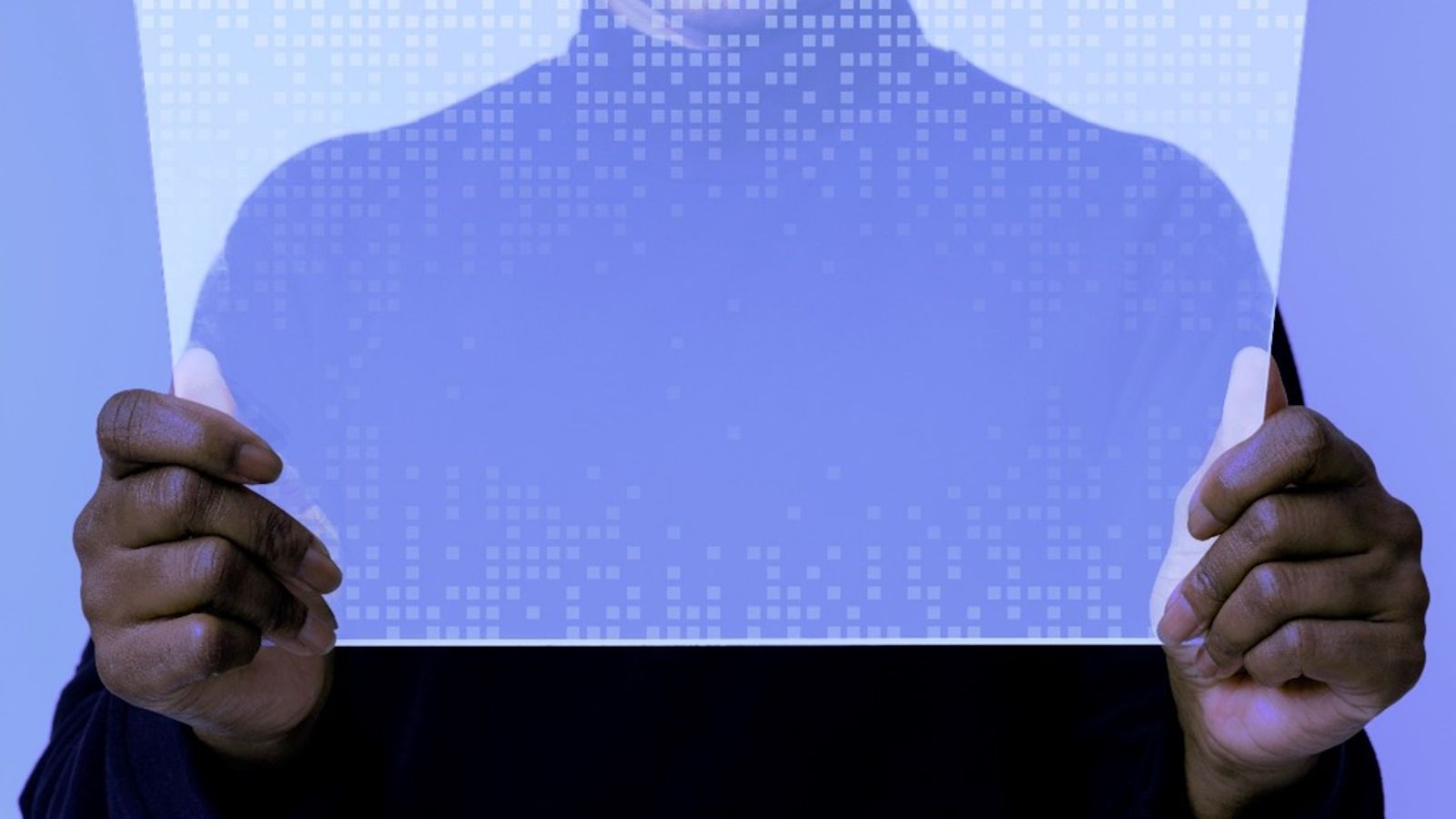 A person's torso in front of a glass screen