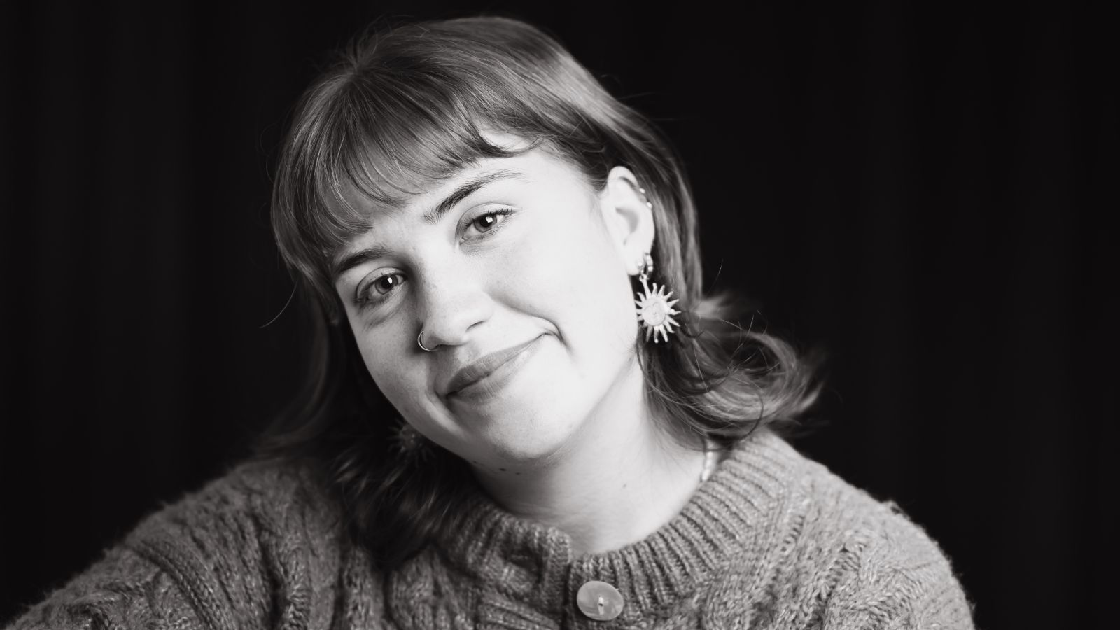 Black and white portrait photo of Lara Speer