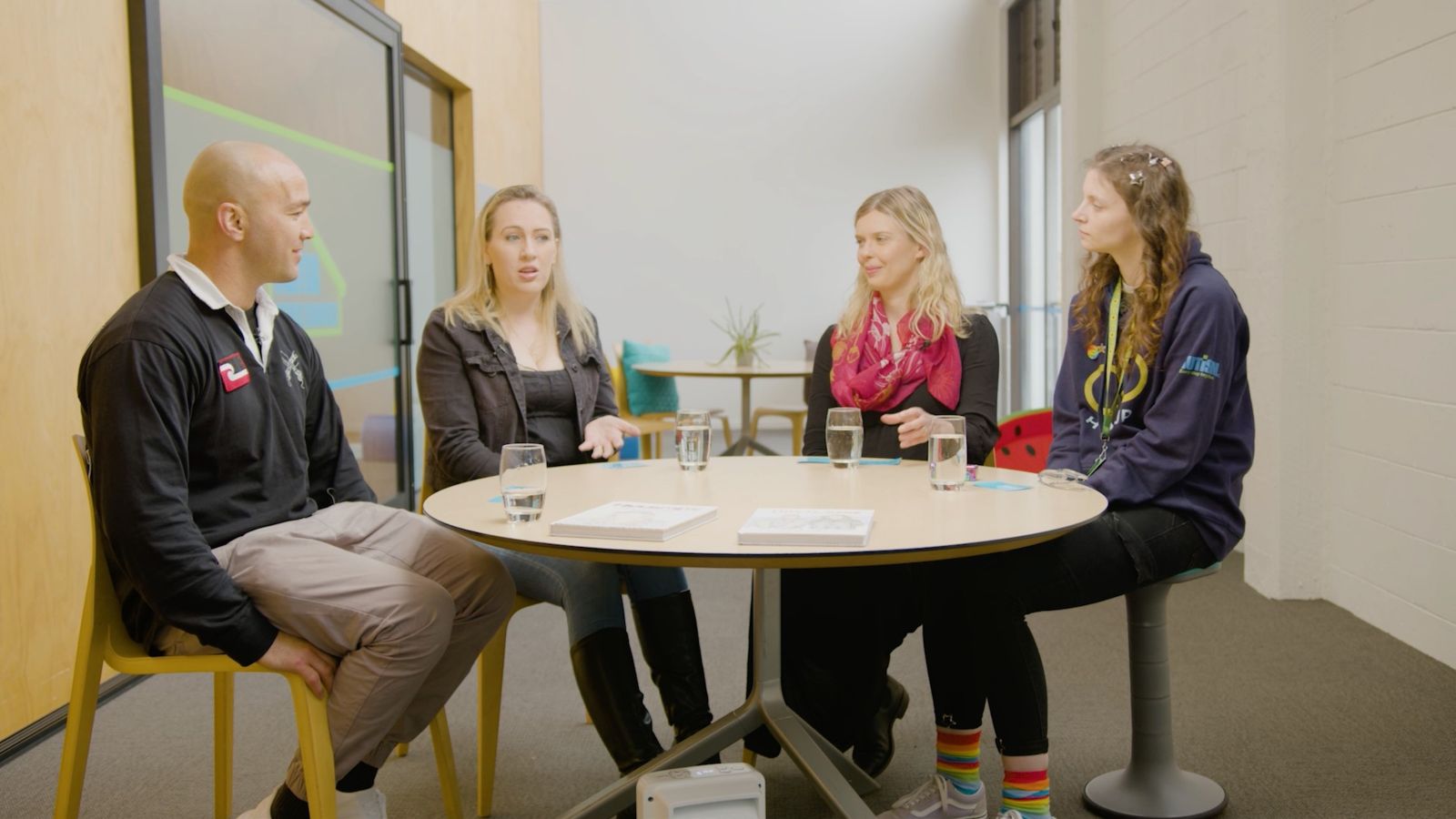 Four people sitting around a table