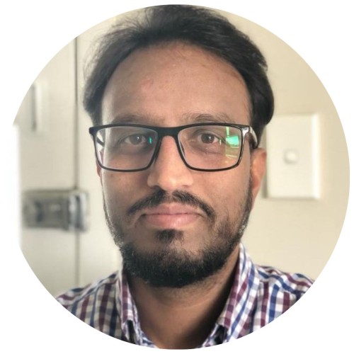 Man with dark hair and glasses.