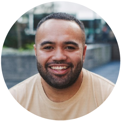 Pasifika man with dark hair smiling. 