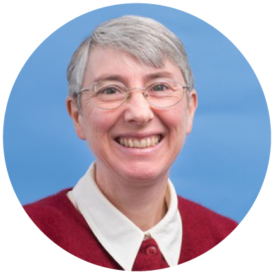 Woman with white short hair smiling