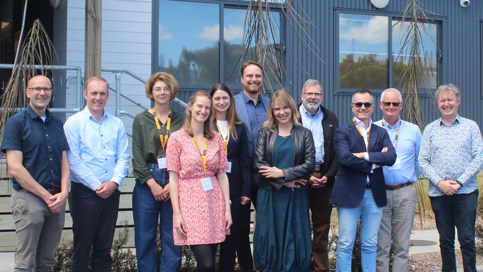 A group of scientists standing in the bright sunlight