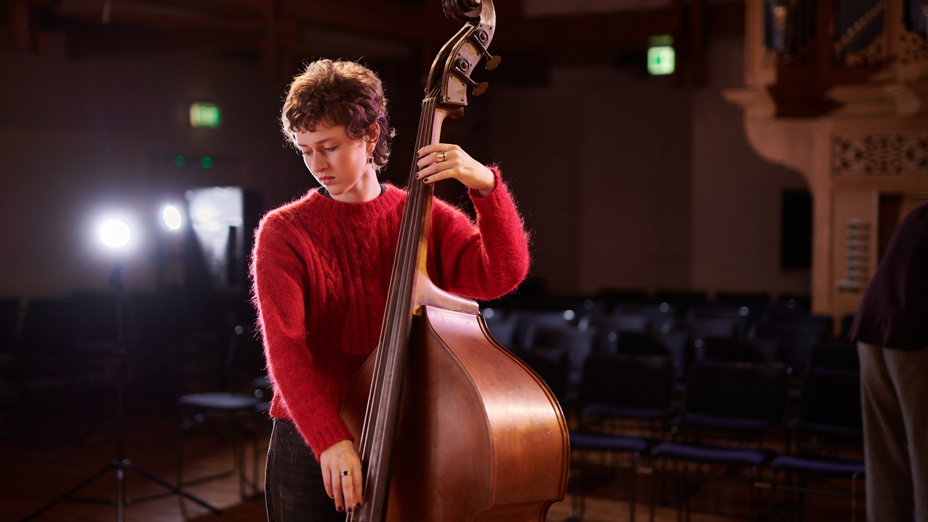 Person playing an instrument.