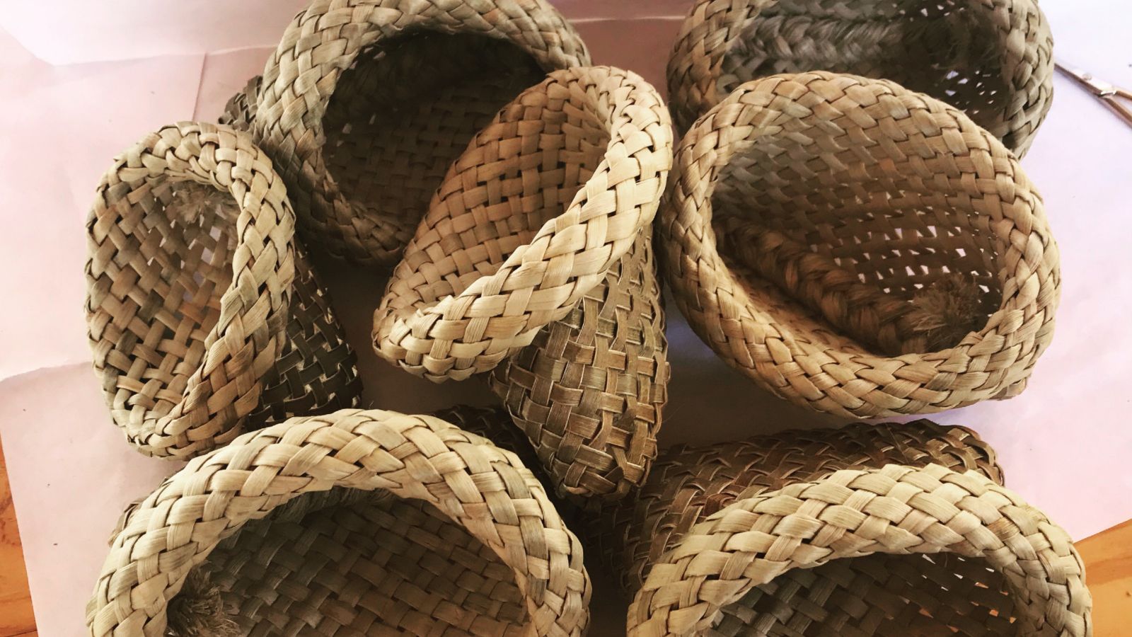 Seven tradtional Maori woven flax baskets