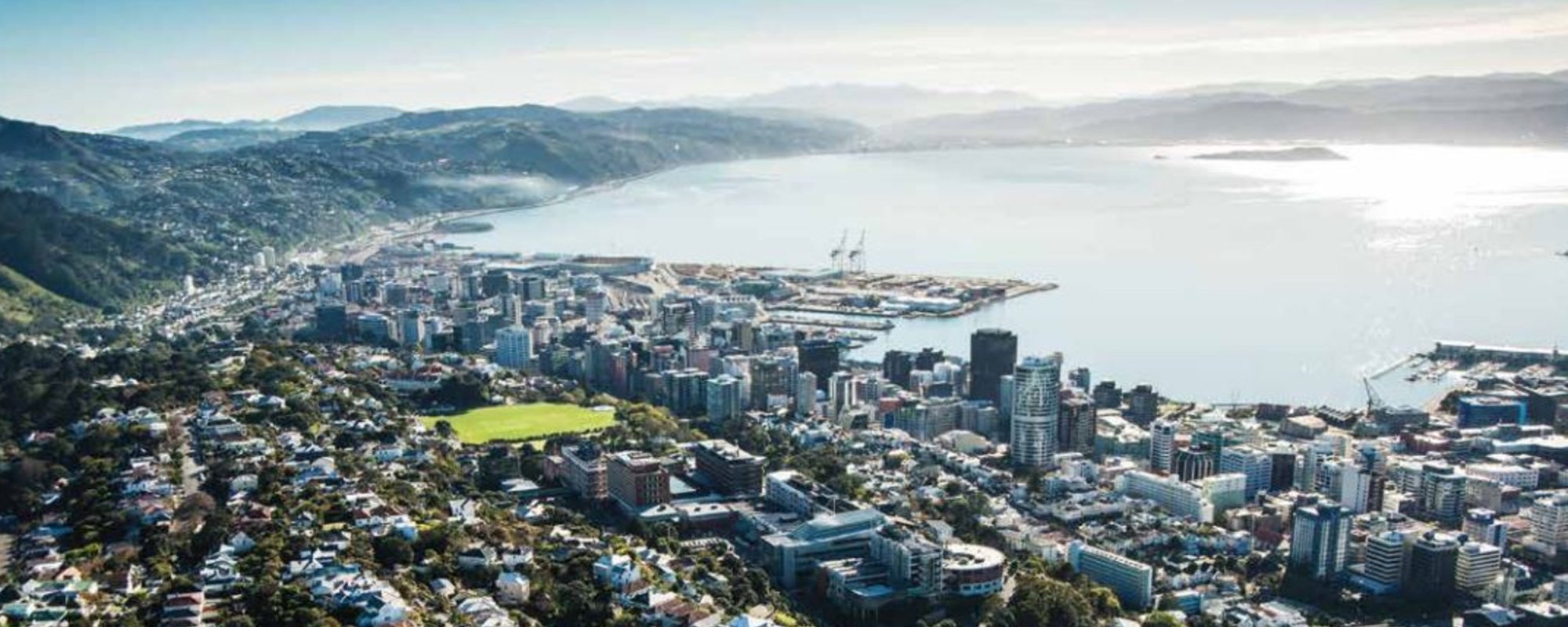 An aerial shot of Wellington city from above the University buildings also showing the harbour