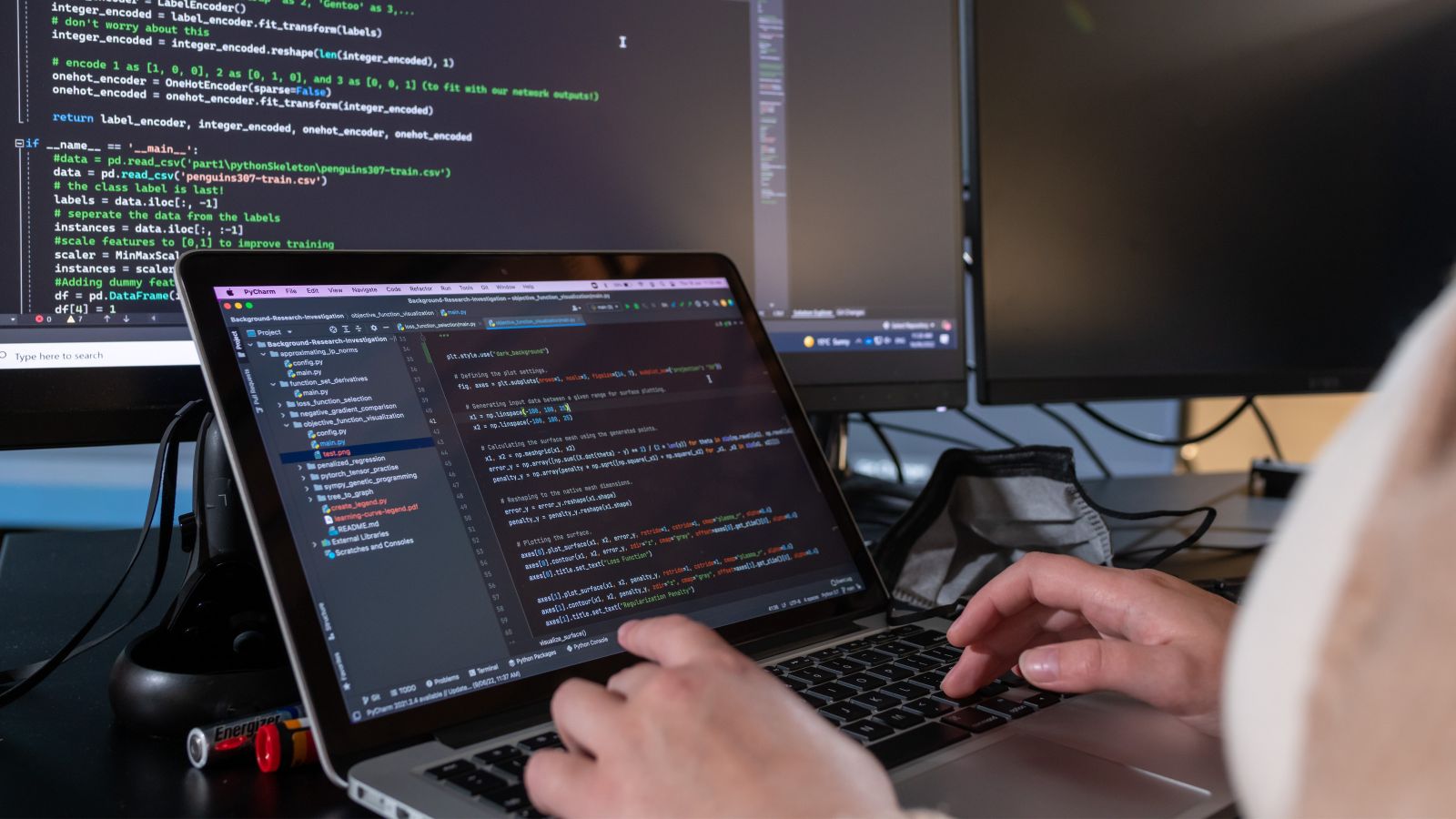 A student coding on a computer.
