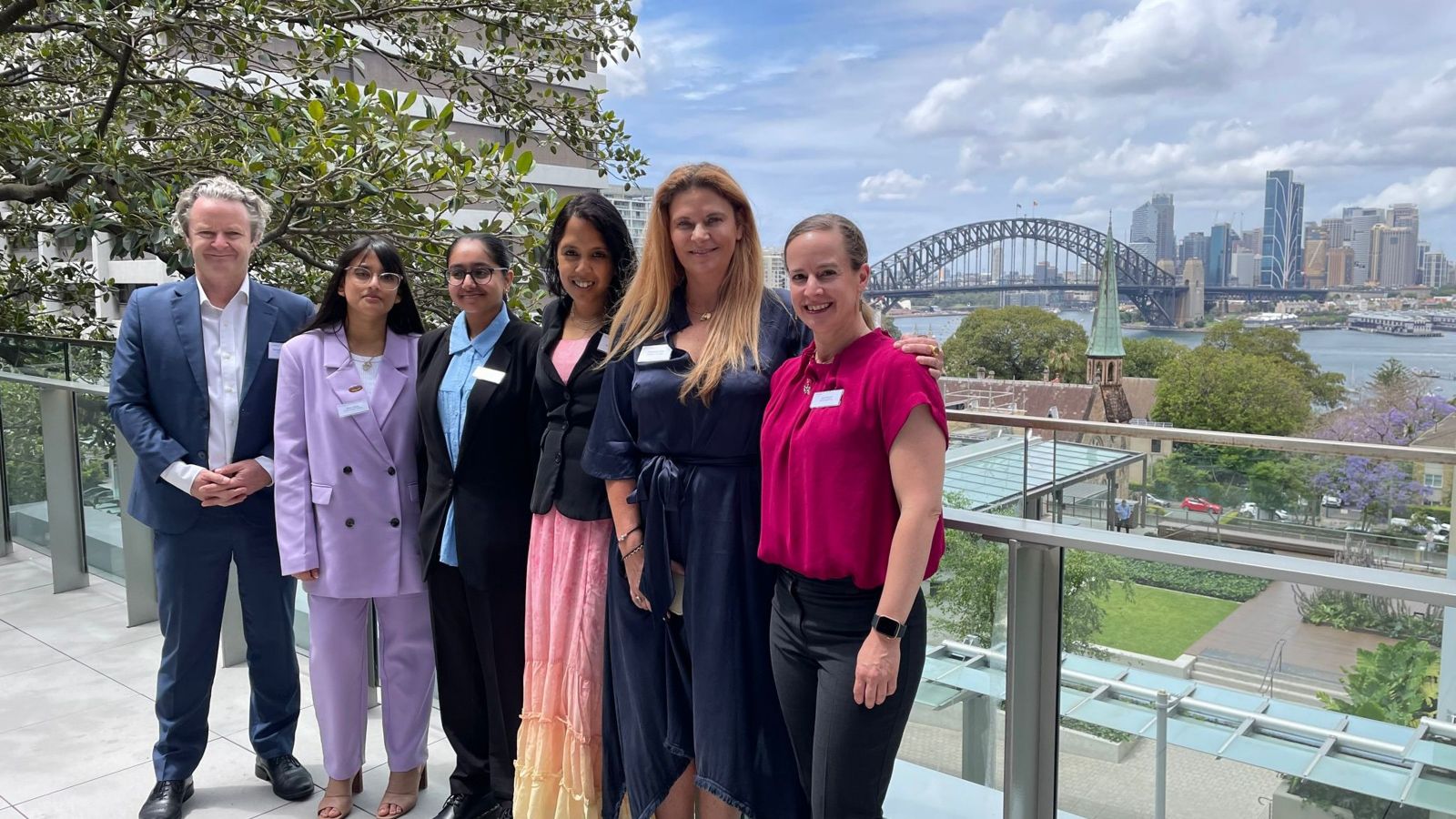 Team at sustainathon with outdoor Sydney harbour bridge background