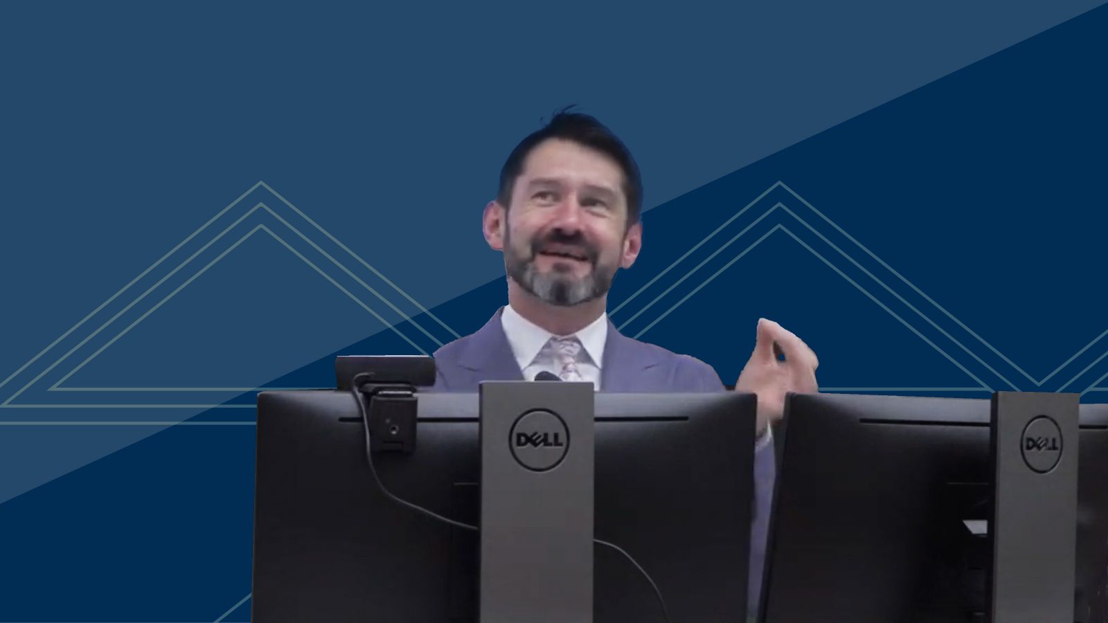 man at a podium delivering a lecture