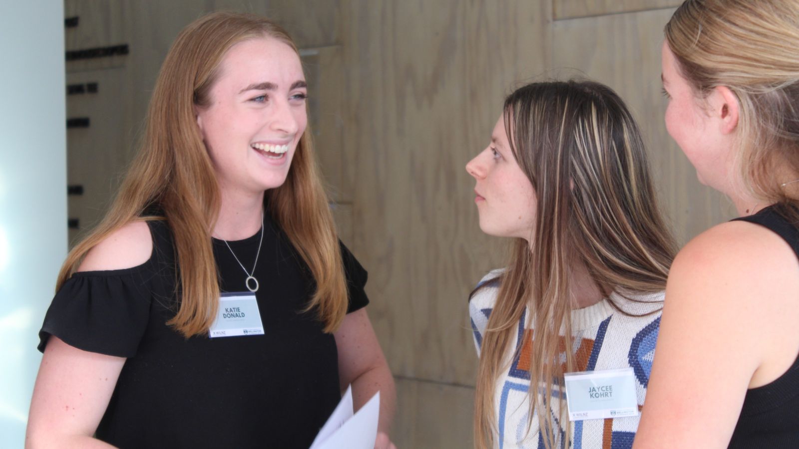 Katie speaks with colleagues