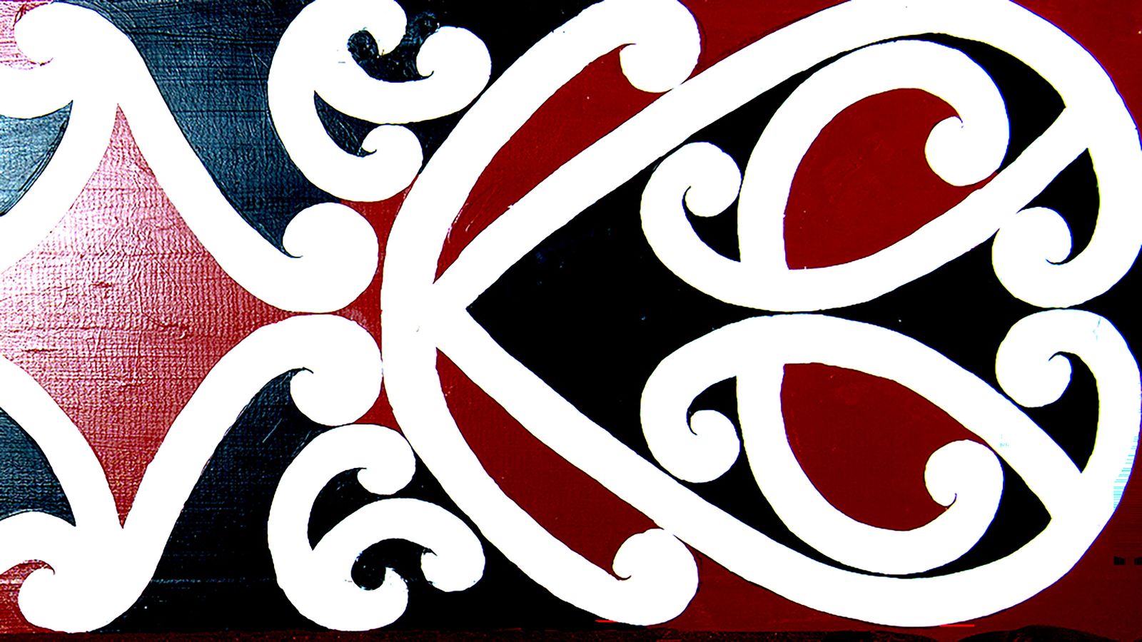 Māori kōwhaiwhai pattern with white spirals on a red and black background