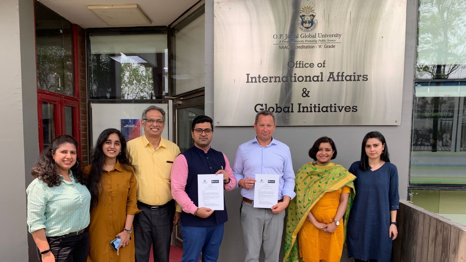 Group of seven people in front of OP Jindal university