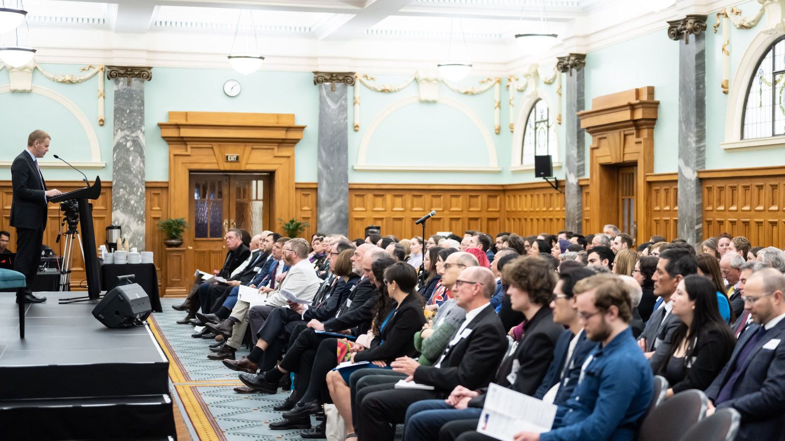 man speaking to large crowd 