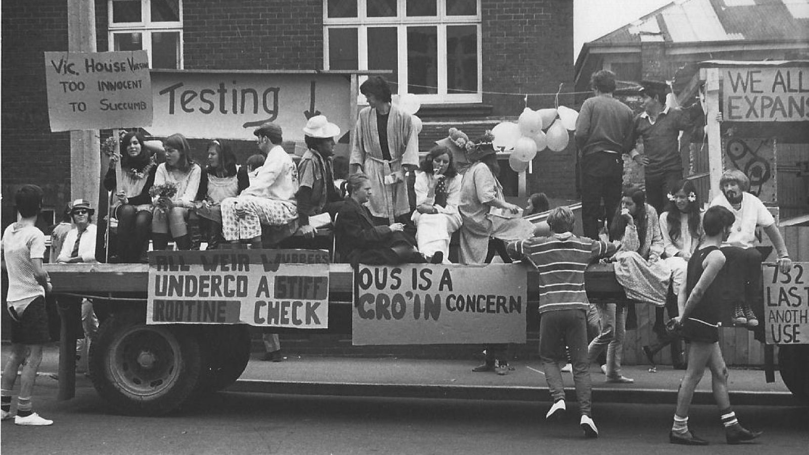 Students with signs on truck