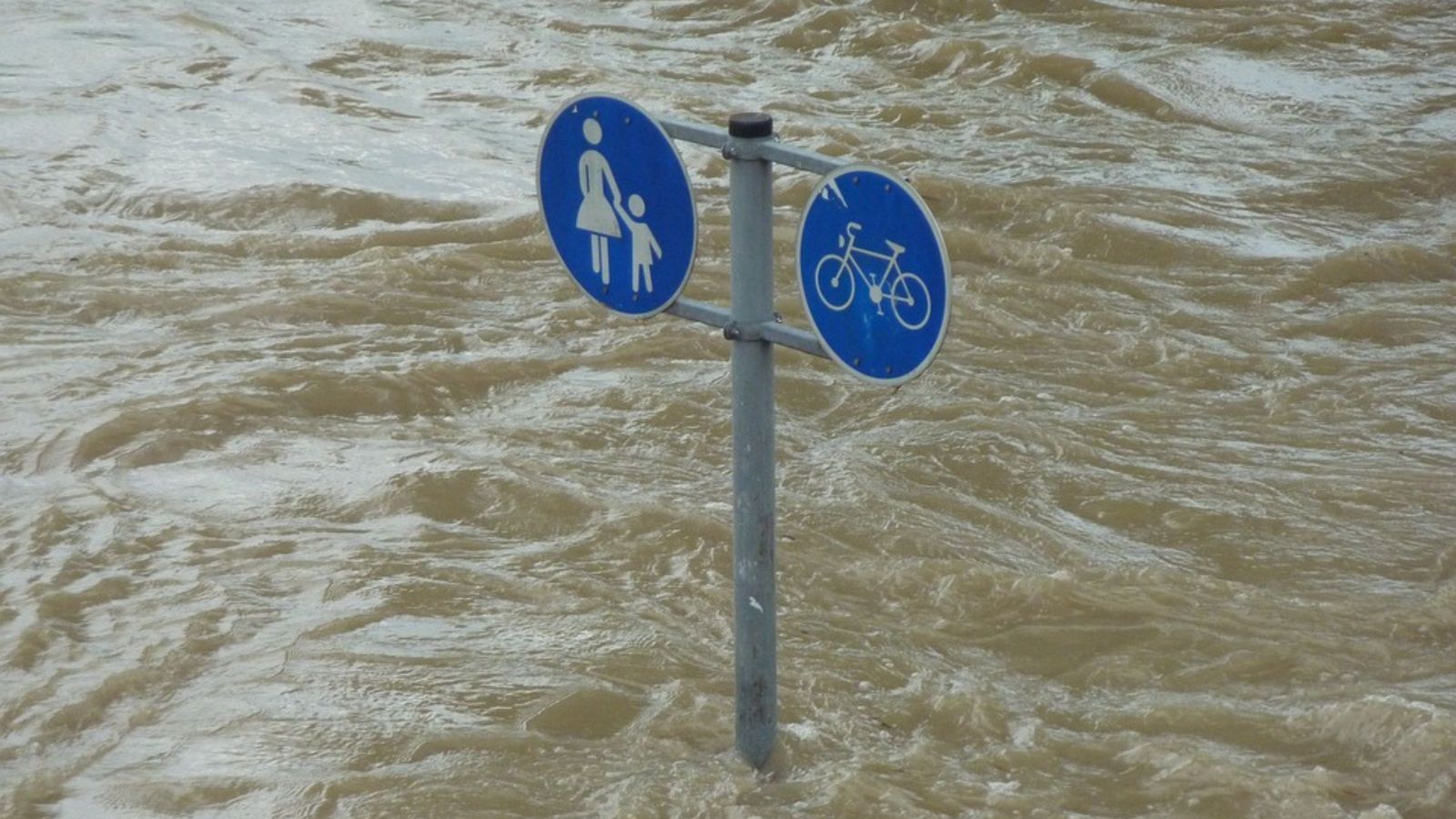 flood waters with sign poking out