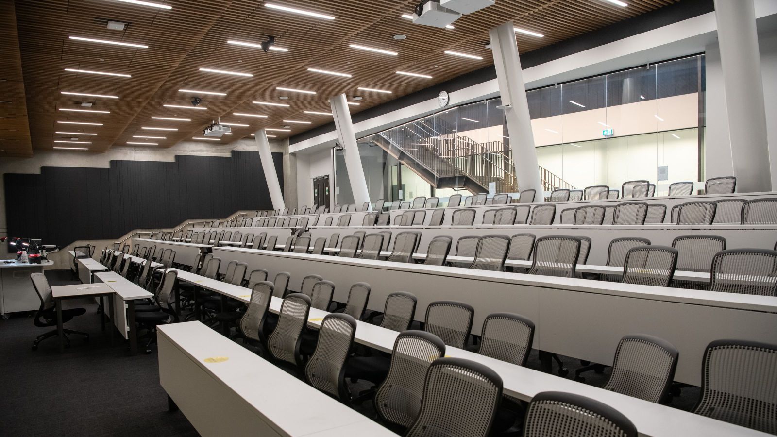 image of lecture theatre with bar style LED lights in ceiling