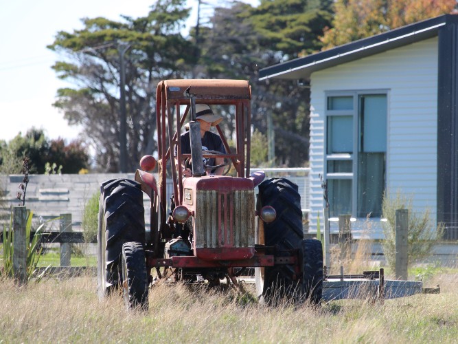 Wendy Allison on a tractor in rural setting
