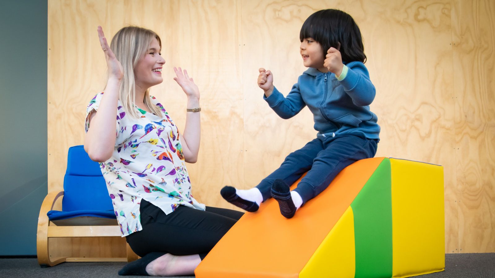 Staff and child at Autism Clinic Staff member and child at the Autism Clinic