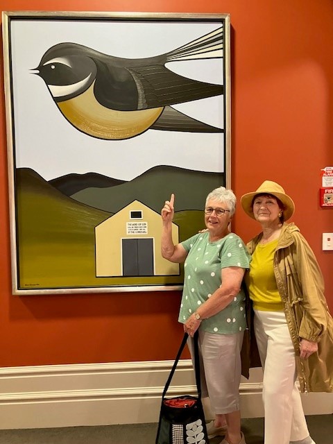 Annette and Margaret in front of art work.