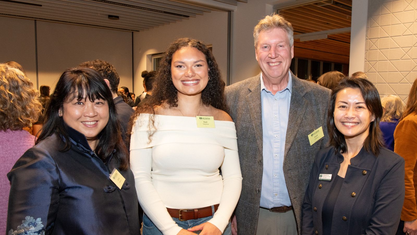 Four people smiling at camera