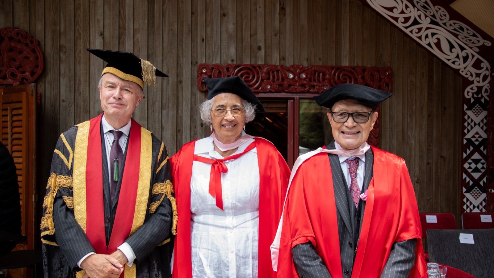Hon-docs-and-Chancellor.jpg Chancellor John Allen with the two Honorary Doctorate recipients, standing in front of Te Herenga Waka's marae
