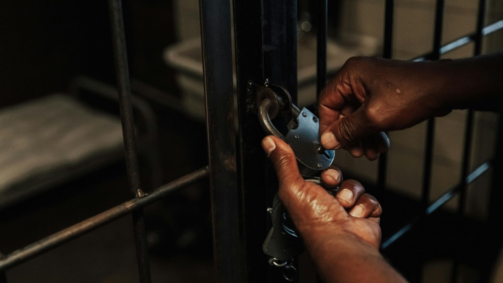 Close-up of padlock on prison door 