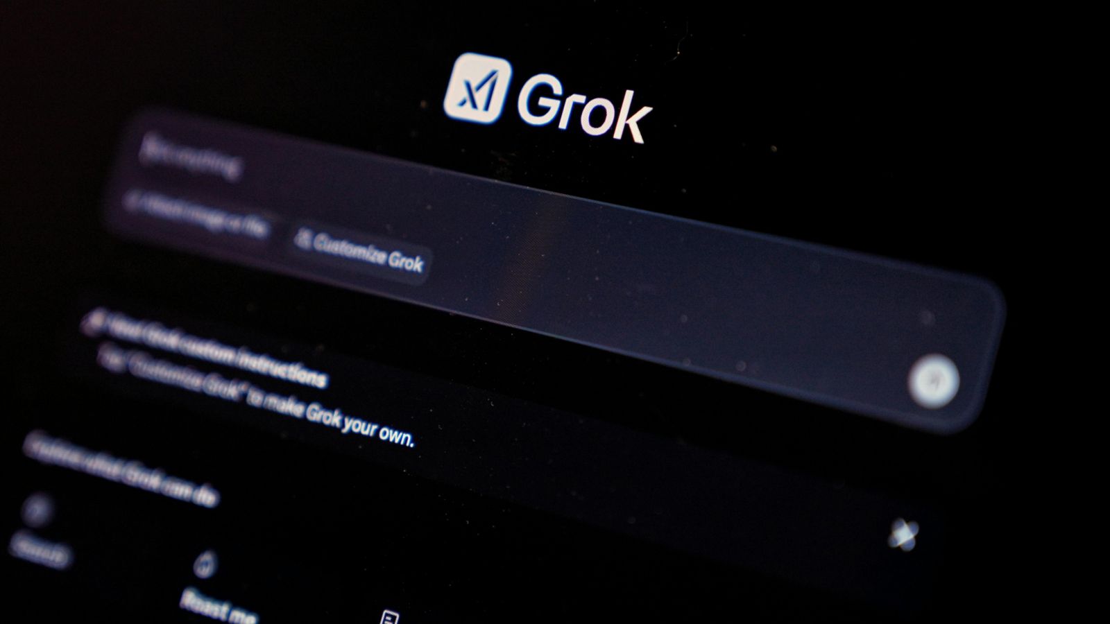 Mobile phone showing app logo 