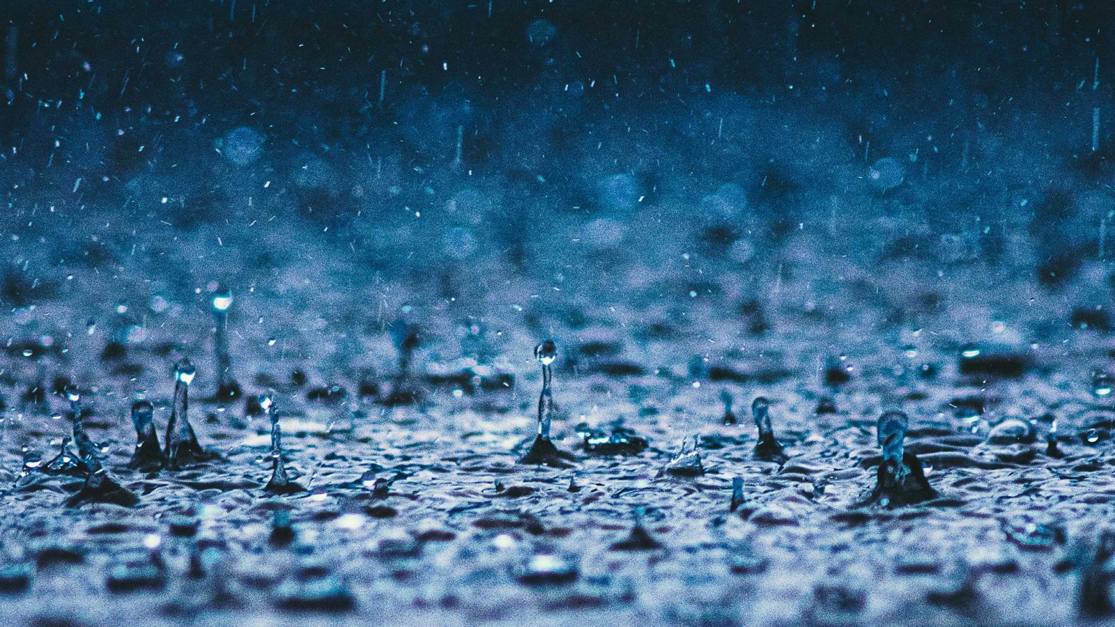 Rain falling on pavement