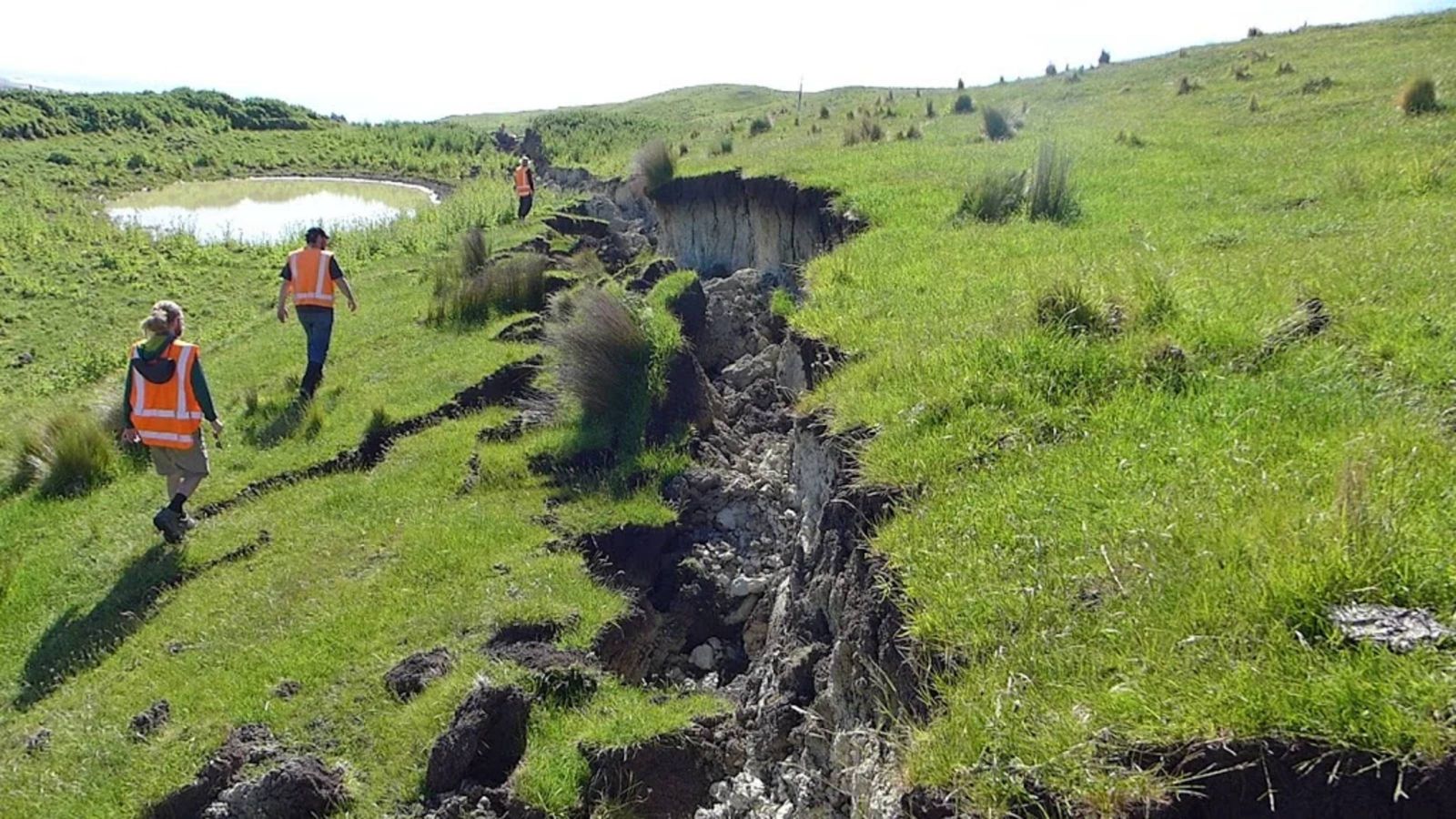 Large crack visible in a field following an earthquake 